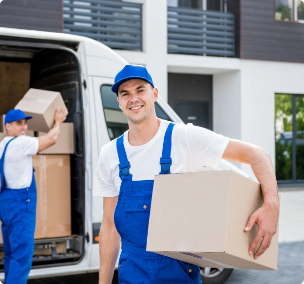two-removal-company-workers-unloading-boxes-from-minibus-into-new-home 1